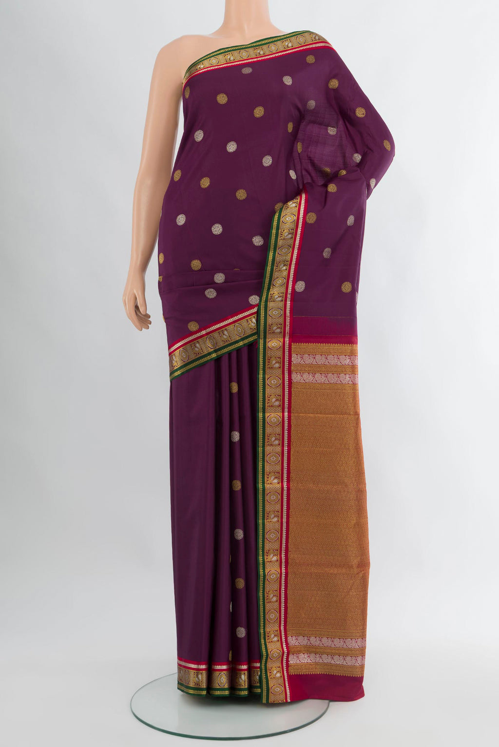 Purple Kanjivaram Silk Saree with Zari Butta on the body and Zari Border.  displayed on a mannequin