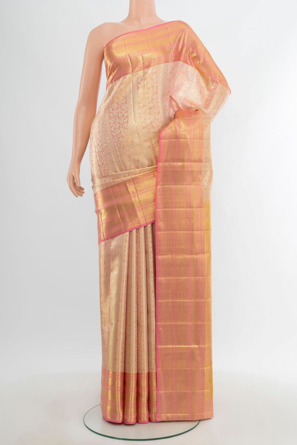Golden Kanjivaram Tissue Silk Saree with Zari Brocade on the body and Zari Border.  displayed on a mannequin