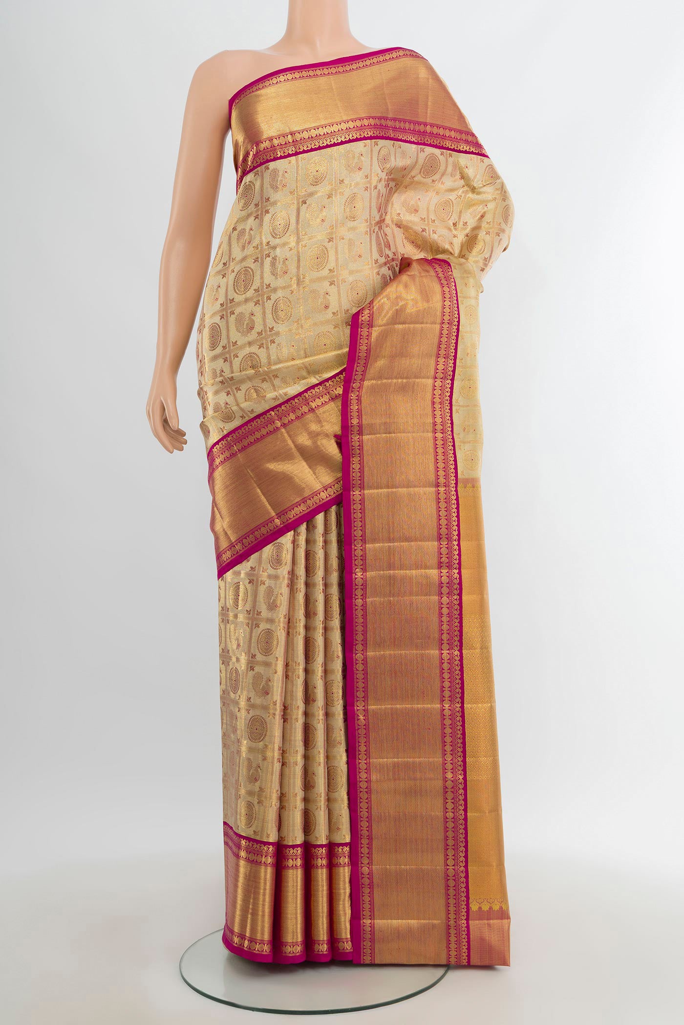 Golden Kanjivaram Tissue Silk Saree with Zari Brocade on the body and Zari Border.  displayed on a mannequin