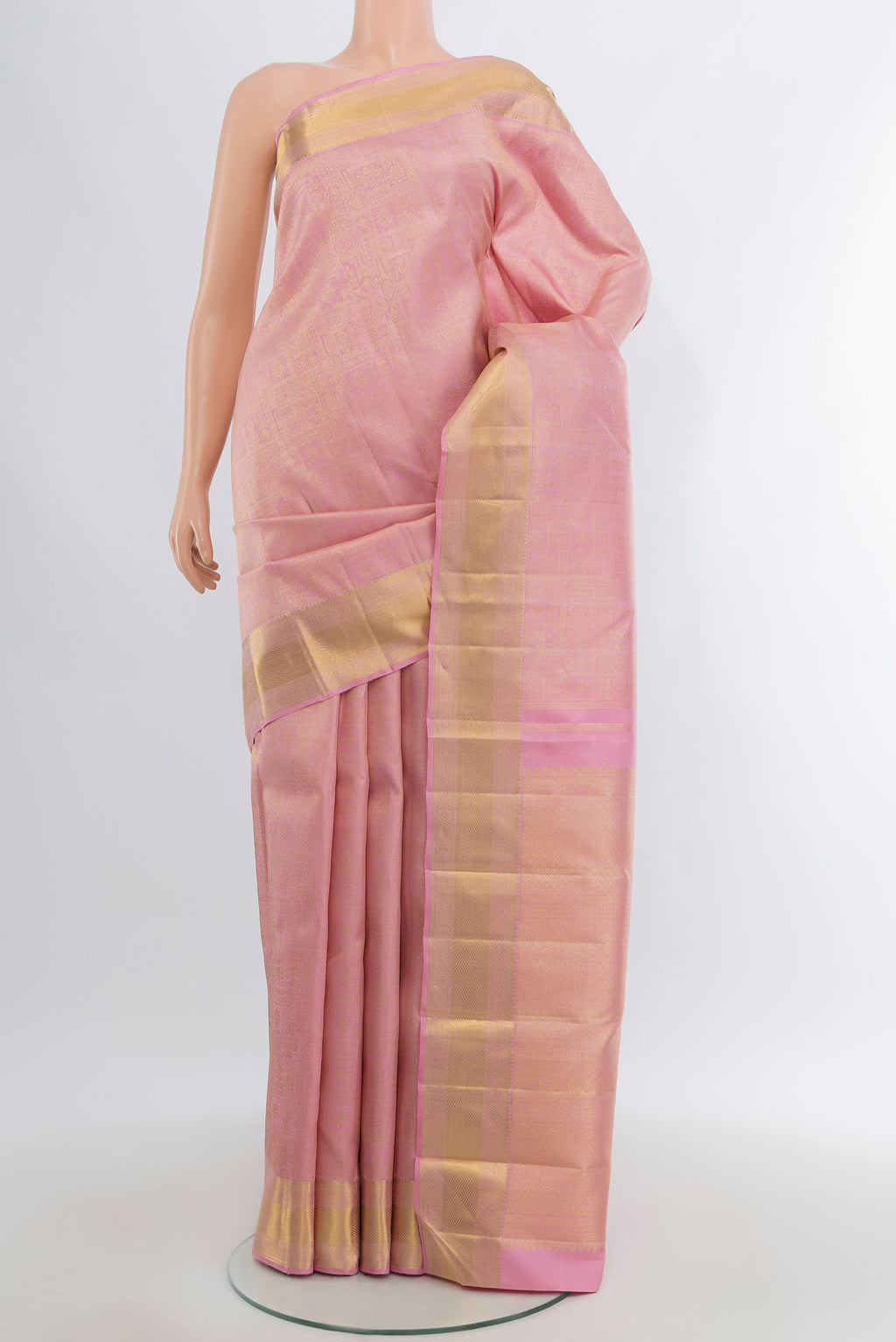 Pure Silk Pure Zari Rose Gold Kanjivaram Saree with Zari Brocade on the body and Zari Border.  displayed on a mannequin