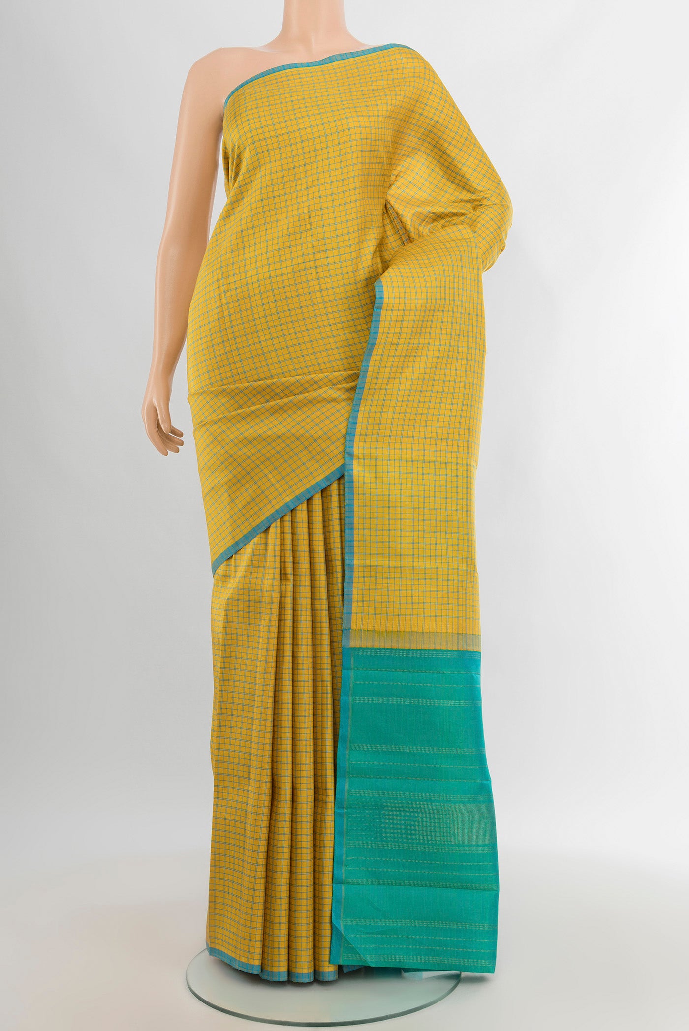 Pure Silk Pure Zari Yellow Kanjivaram Saree with Checked design on the body and Without Border.  displayed on a mannequin