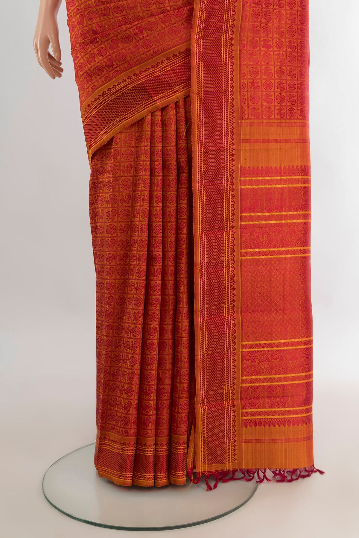 Pleats and pallu of Pure Silk Orange Kanchipuram Saree with Jacquard design on the body and Thread Border. 