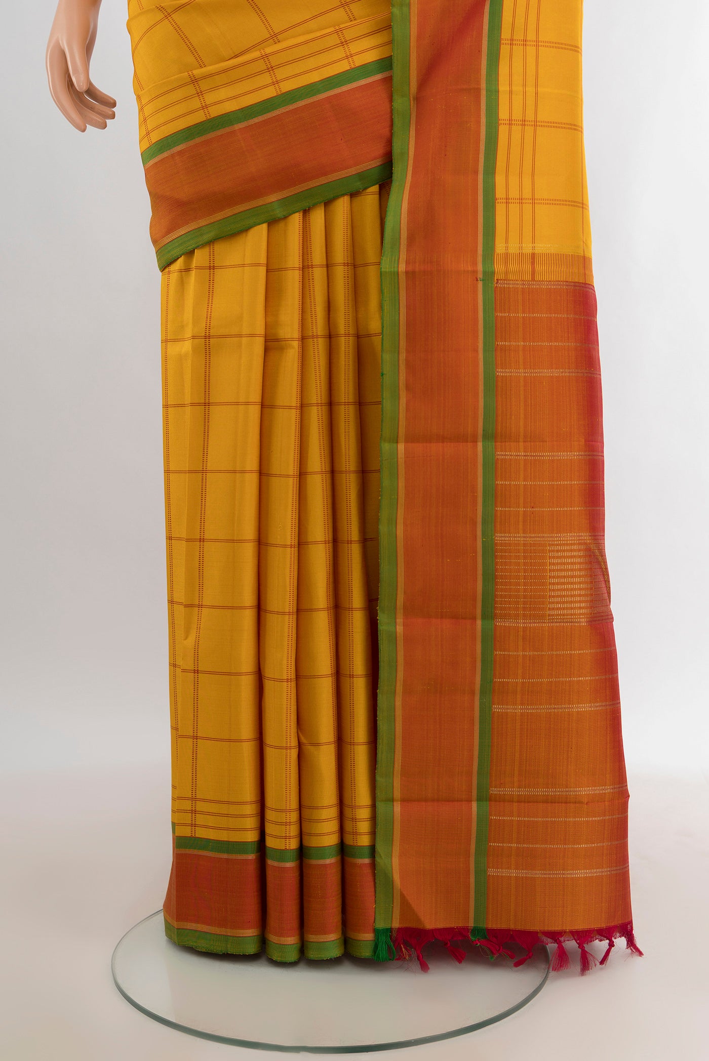 Pleats and pallu of Mustard Kanjivaram Silk Saree with Checked design on the body and Plain Border. 
