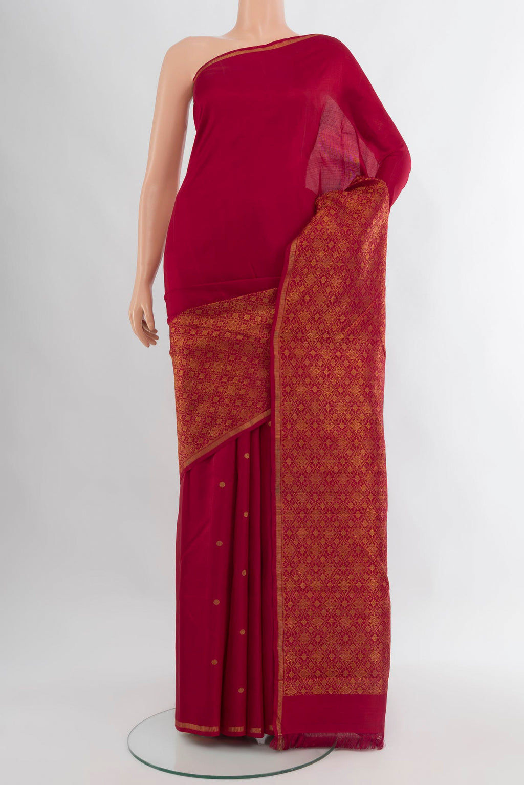 Pure Silk Pure Zari Maroon Kanchipuram Saree with Zari Butta on the body and Zari Border.  displayed on a mannequin