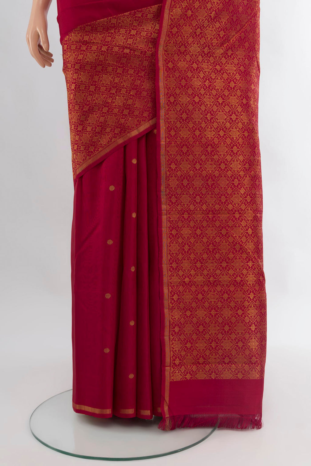 Pleats and pallu of Pure Silk Pure Zari Maroon Kanchipuram Saree with Zari Butta on the body and Zari Border. 