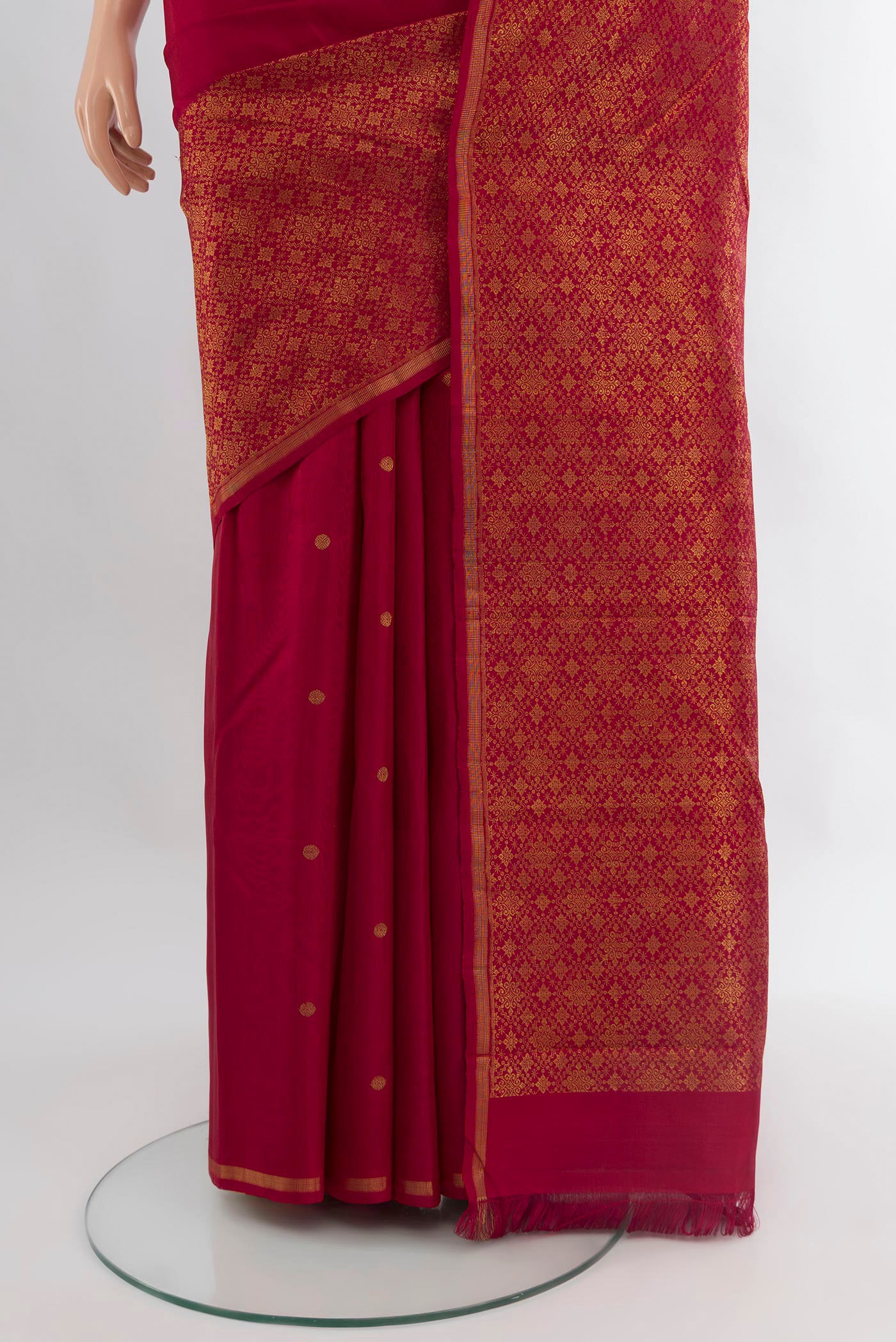 Pleats and pallu of Pure Silk Pure Zari Maroon Kanchipuram Saree with Zari Butta on the body and Zari Border. 