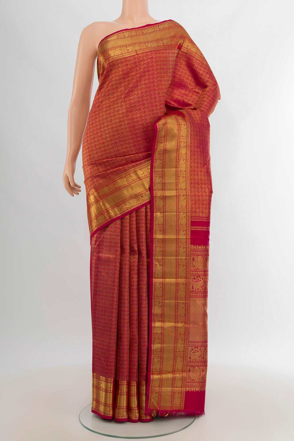 Pure Silk Pure Zari Dark Pink Kanjivaram Saree with Zari Brocade on the body and Zari Border.  displayed on a mannequin