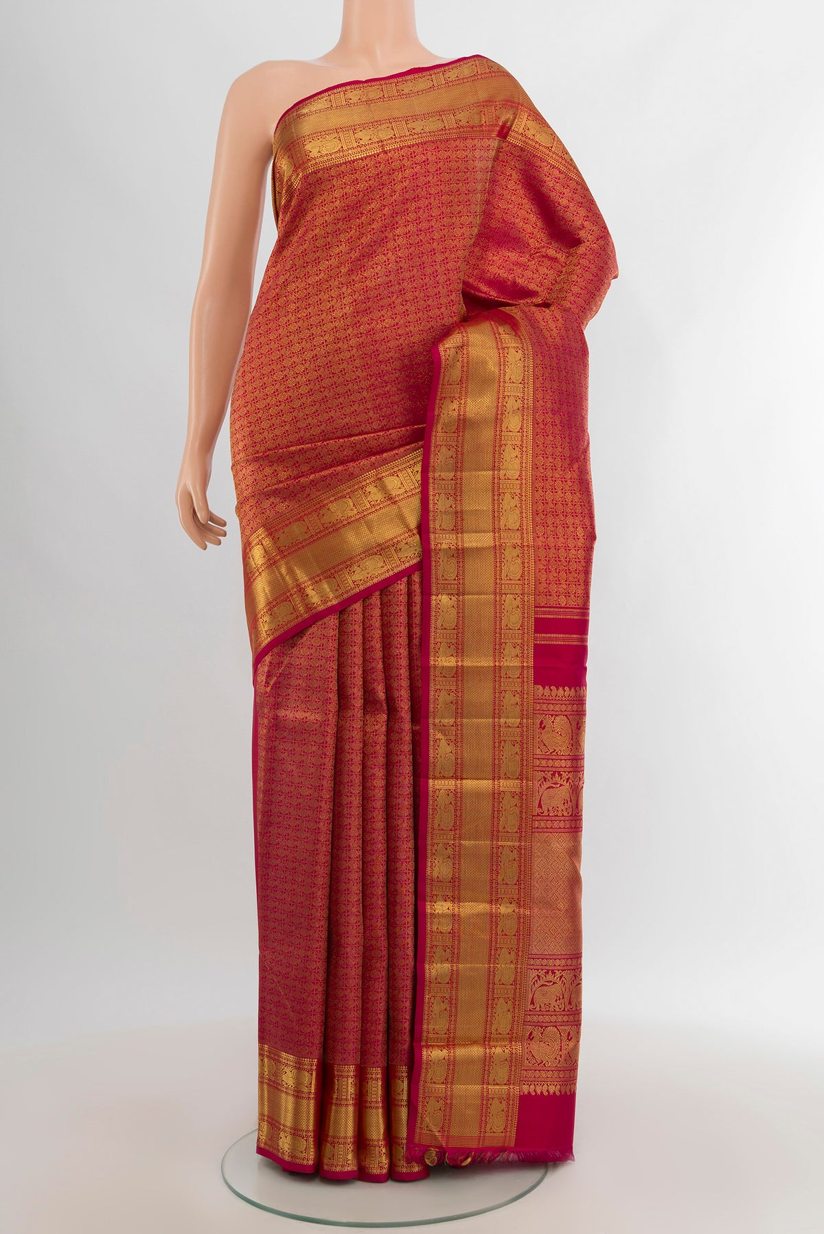 Pure Silk Pure Zari Dark Pink Kanjivaram Saree with Zari Brocade on the body and Zari Border.  displayed on a mannequin