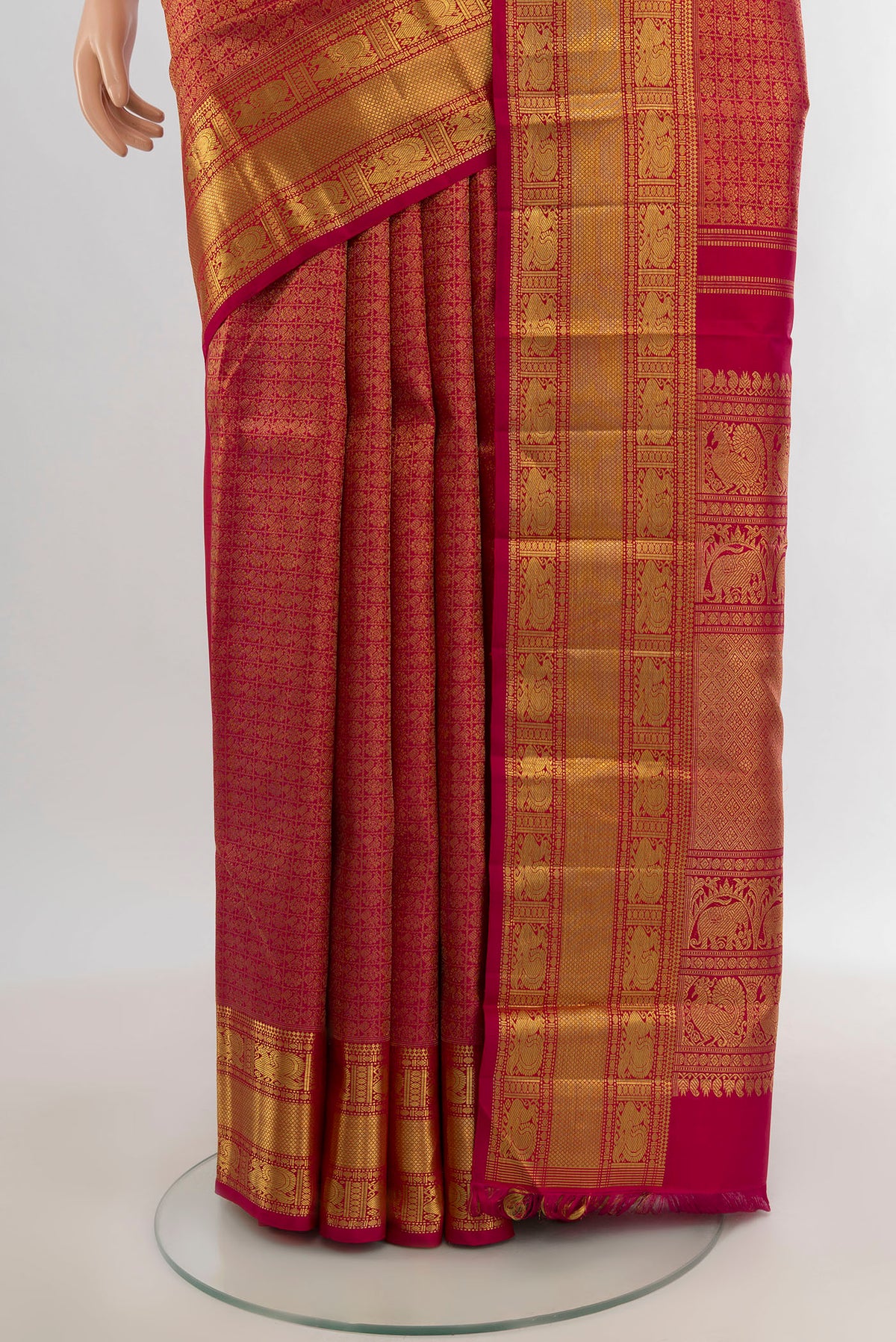 Pleats and pallu of Pure Silk Pure Zari Dark Pink Kanjivaram Saree with Zari Brocade on the body and Zari Border. 