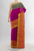 Magenta Kanjivaram Silk Saree with Zari Butta on the body and Ganga Jamuna Border.  displayed on a mannequin