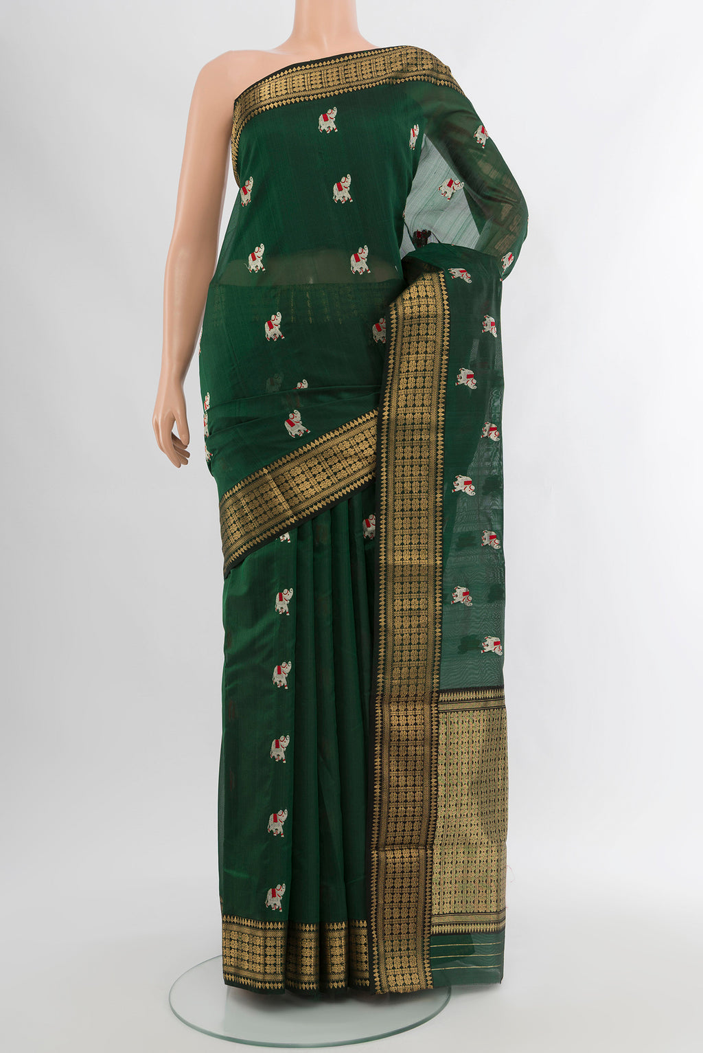 Bottle Green Chanderi Silk Cotton Saree with Zari And Thread Butta on the body and Zari Border.  displayed on a mannequin