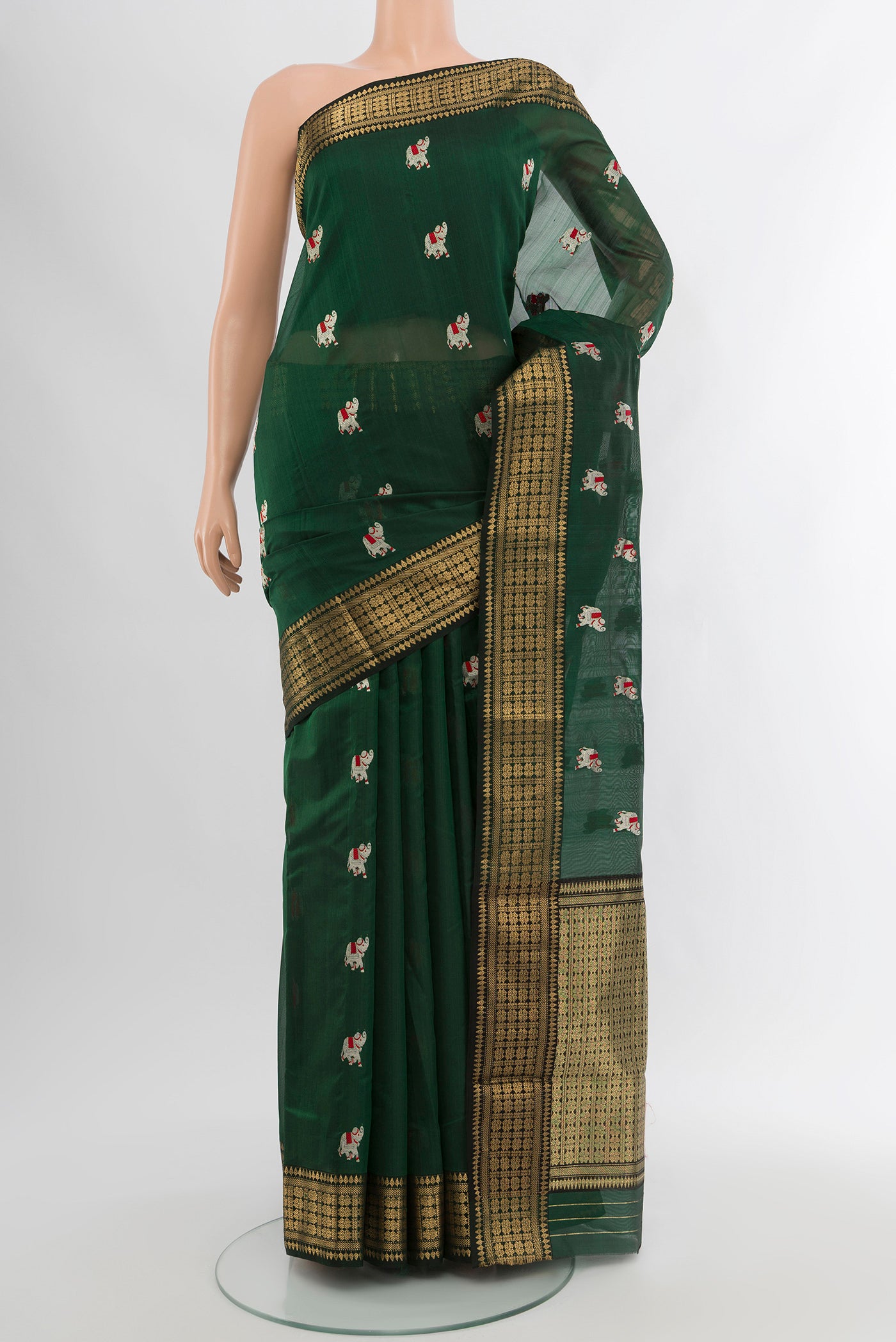 Bottle Green Chanderi Silk Cotton Saree with Zari And Thread Butta on the body and Zari Border.  displayed on a mannequin