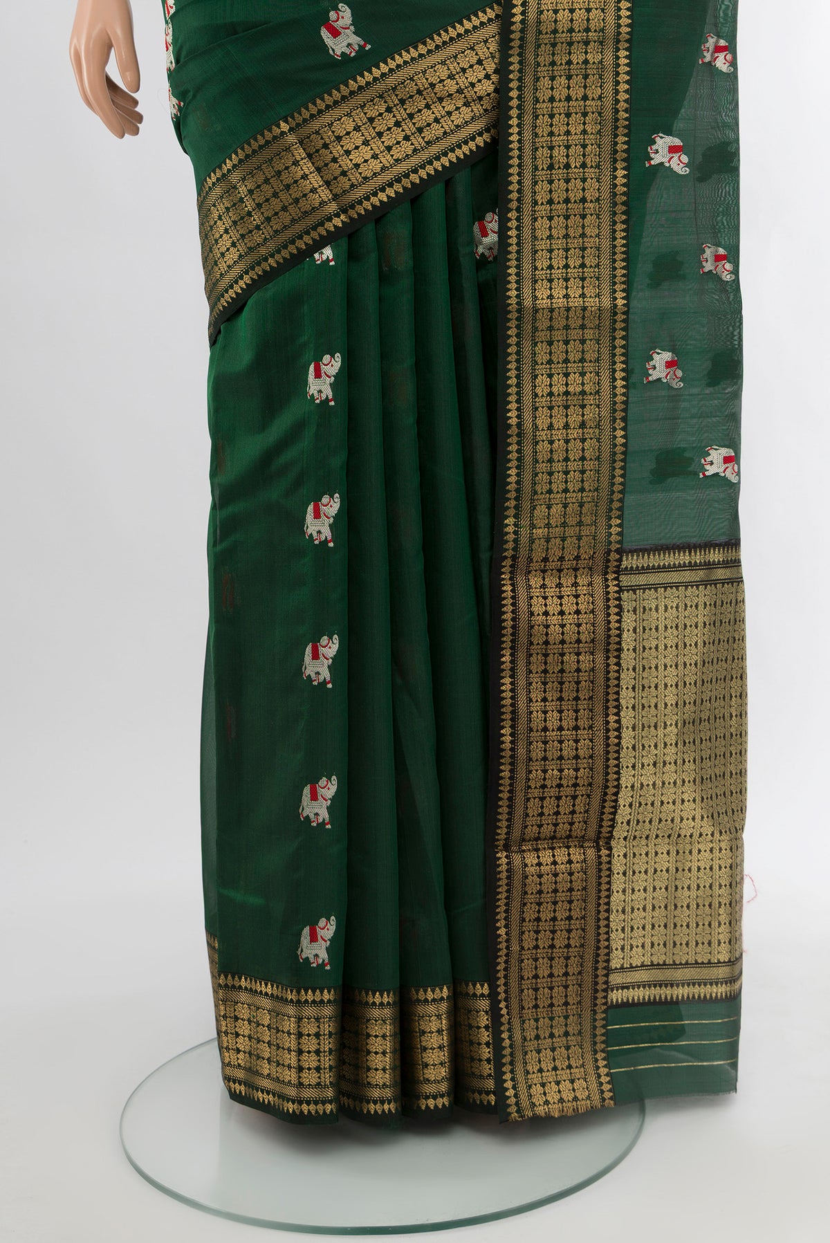 Pleats and pallu of Bottle Green Chanderi Silk Cotton Saree with Zari And Thread Butta on the body and Zari Border. 