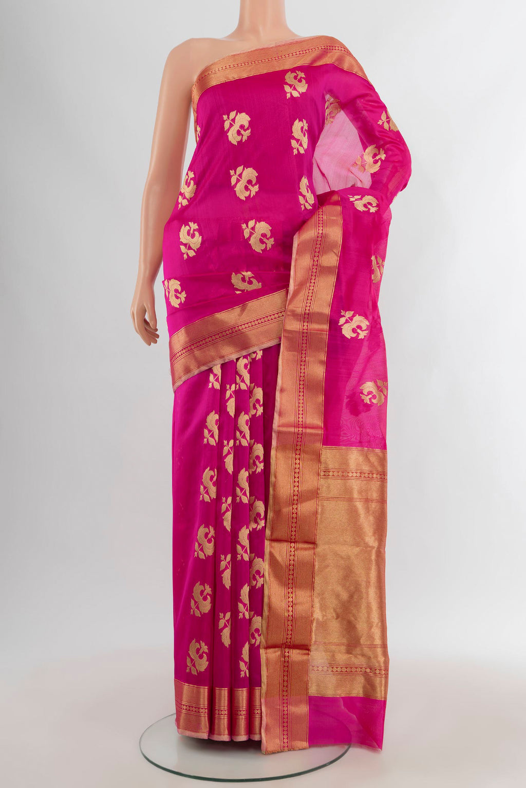 Rani Pink Chanderi Silk Saree with Zari Butta on the body and Zari Border.  displayed on a mannequin