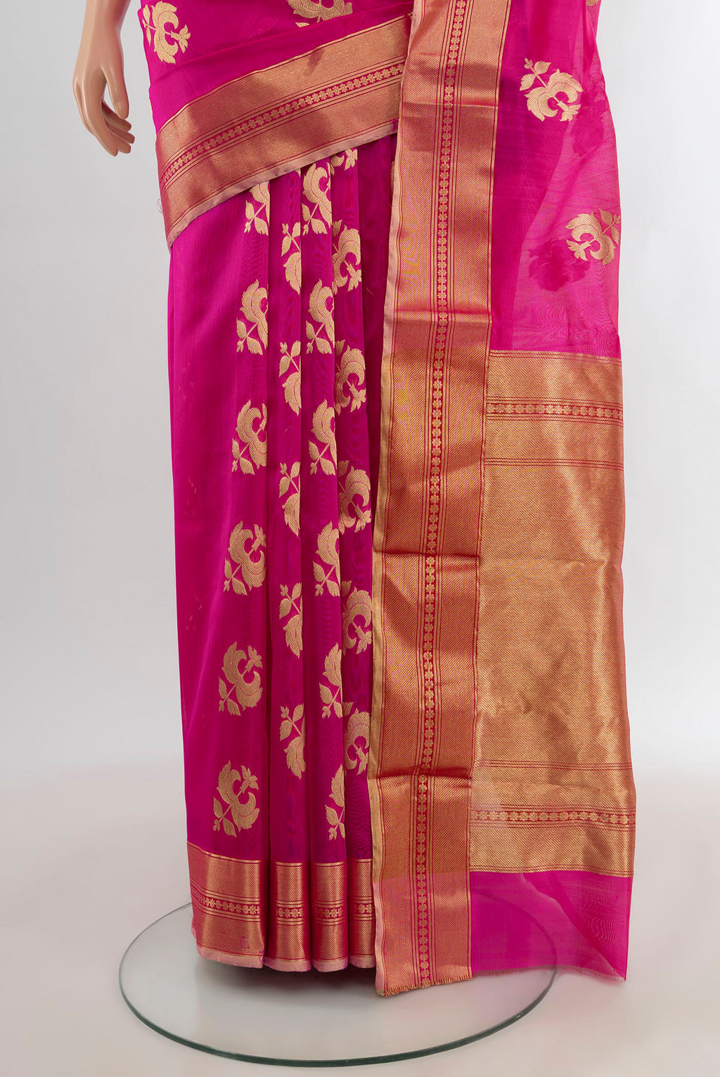 Pleats and pallu of Rani Pink Chanderi Silk Saree with Zari Butta on the body and Zari Border. 