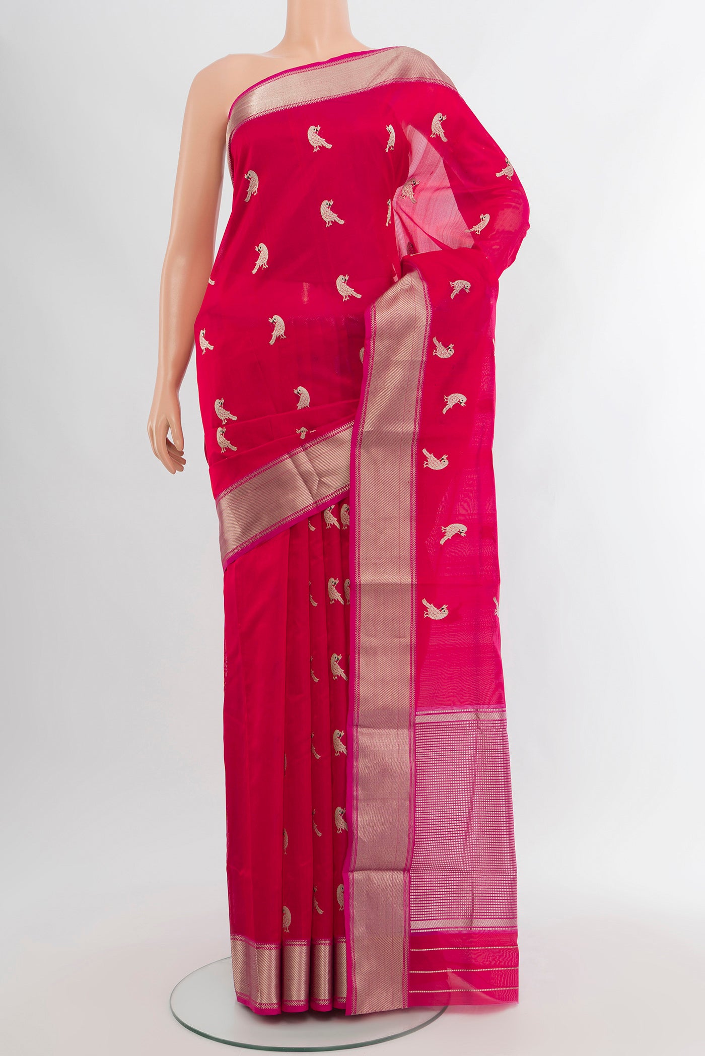Dark Pink Chanderi Silk Cotton Saree with Zari Butta on the body and Zari Border.  displayed on a mannequin
