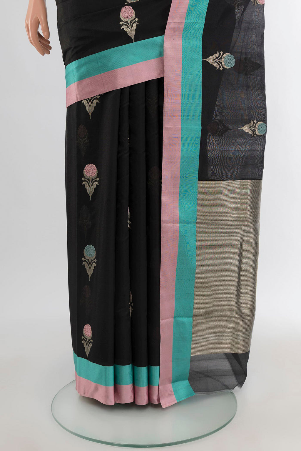 Pleats and pallu of Black Chanderi Silk Cotton Saree with Zari Butta on the body and Plain Border. 