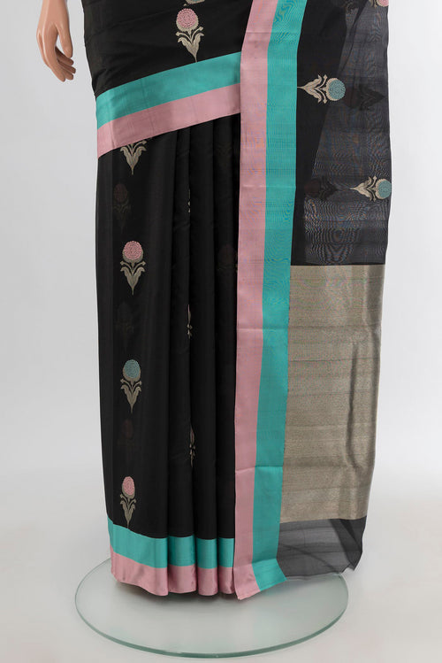 Pleats and pallu of Black Chanderi Silk Cotton Saree with Zari Butta on the body and Plain Border. 