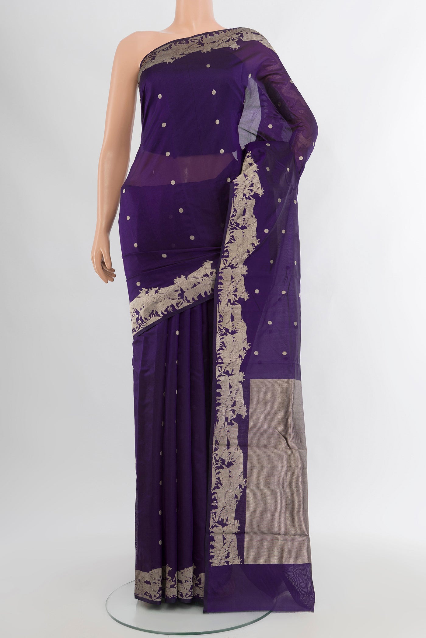 Violet Chanderi Silk Cotton Saree with Zari Butta on the body and Fancy Border.  displayed on a mannequin