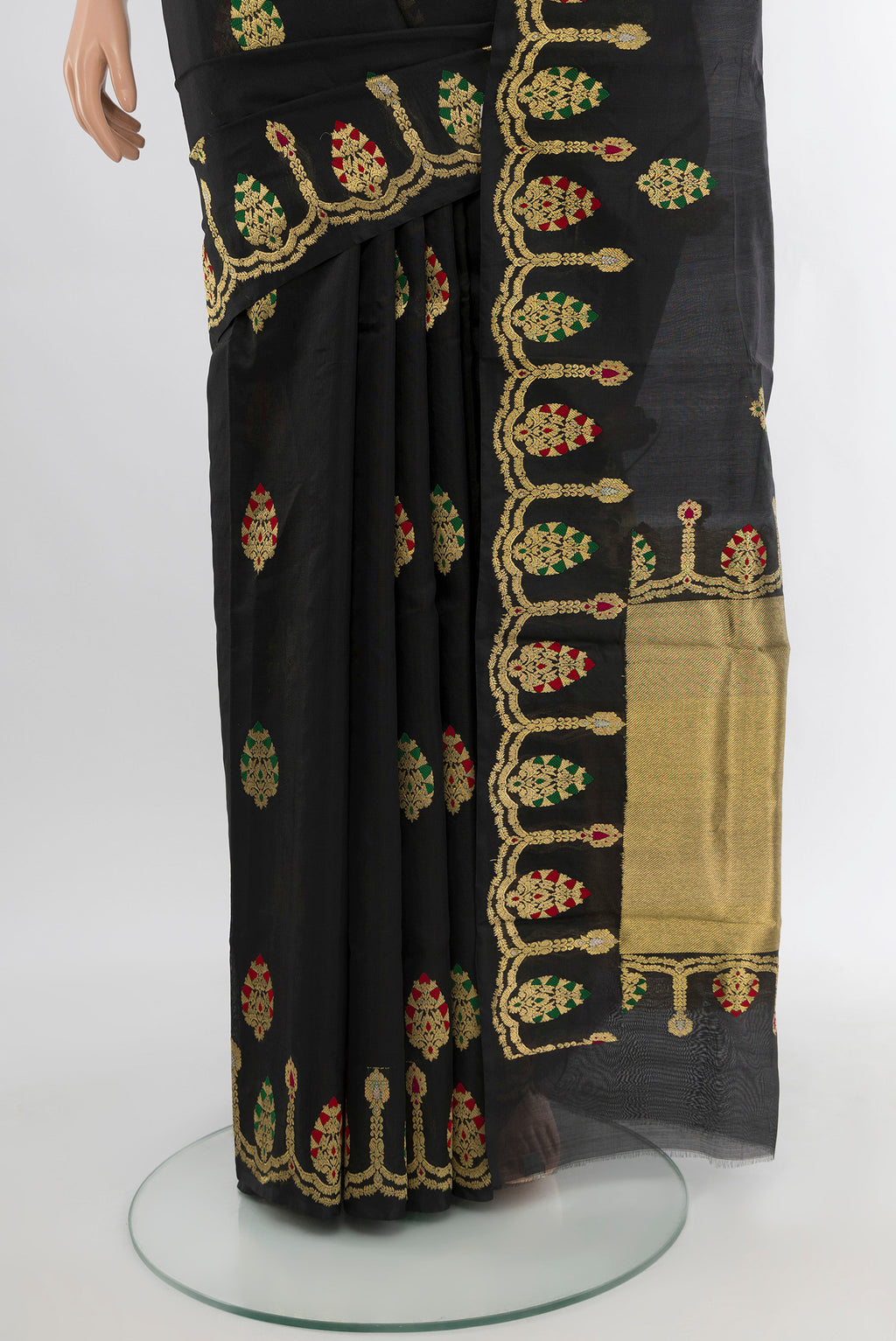 Pleats and pallu of Black Chanderi Silk Cotton Saree with Zari Butta on the body and Fancy Border. 