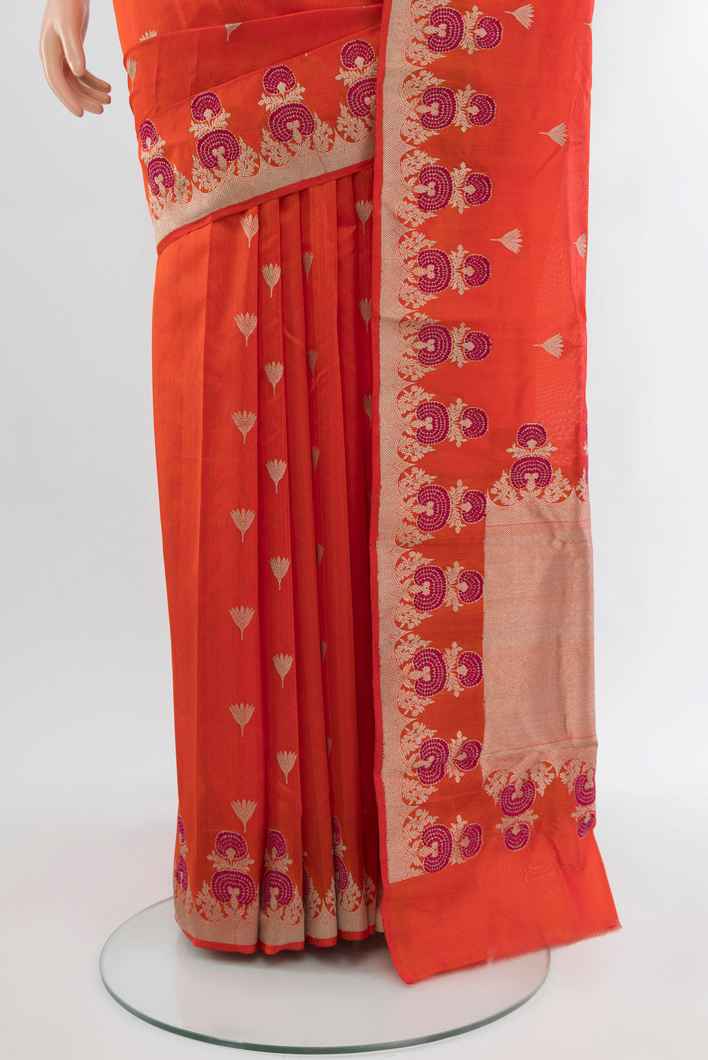 Pleats and pallu of Orange Chanderi Silk Cotton Saree with Zari Butta on the body and Zari Border. 