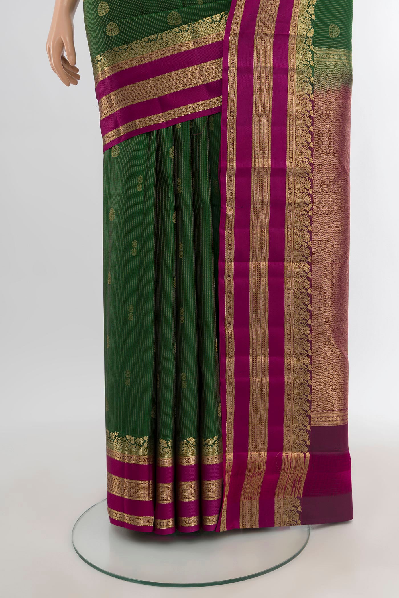 Pleats and pallu of Bottle Green Kanjivaram Silk Saree with Zari Butta on the body and Zari Border. 
