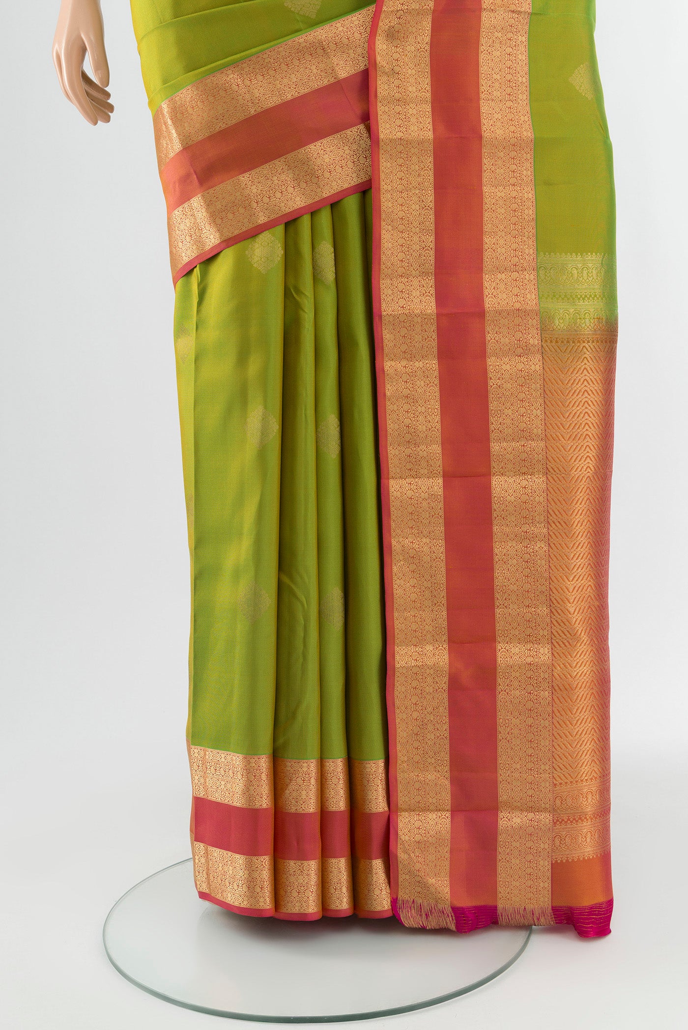 Pleats and pallu of Green Kanchipuram Silk Saree with Zari Butta on the body and Zari Border. 