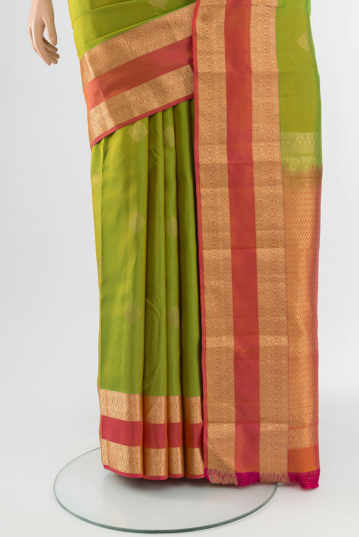 Pleats and pallu of Green Kanchipuram Silk Saree with Zari Butta on the body and Zari Border. 