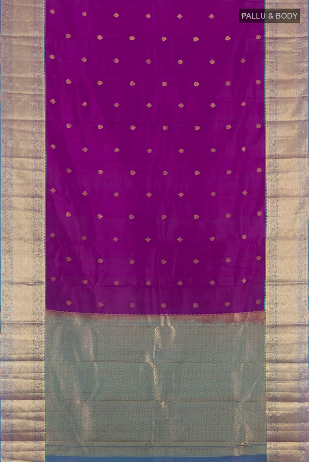Flat view of Purple Kanchipuram Silk Saree with Zari Butta on the body and Zari Border. 