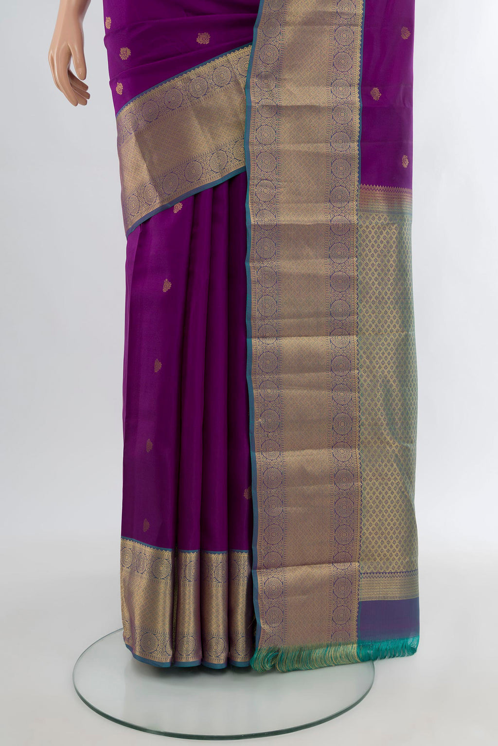Pleats and pallu of Purple Kanchipuram Silk Saree with Zari Butta on the body and Zari Border. 