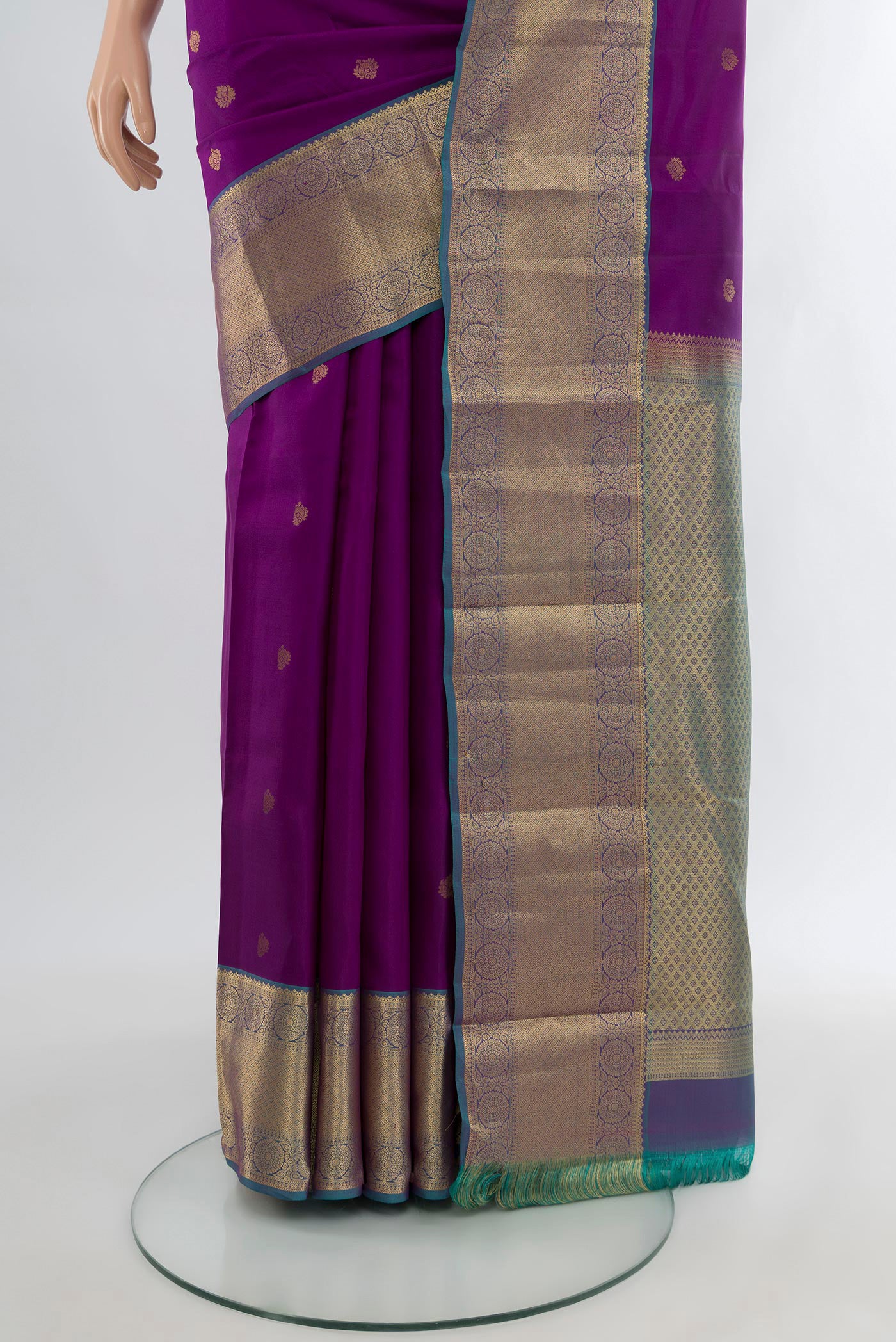Pleats and pallu of Purple Kanchipuram Silk Saree with Zari Butta on the body and Zari Border. 
