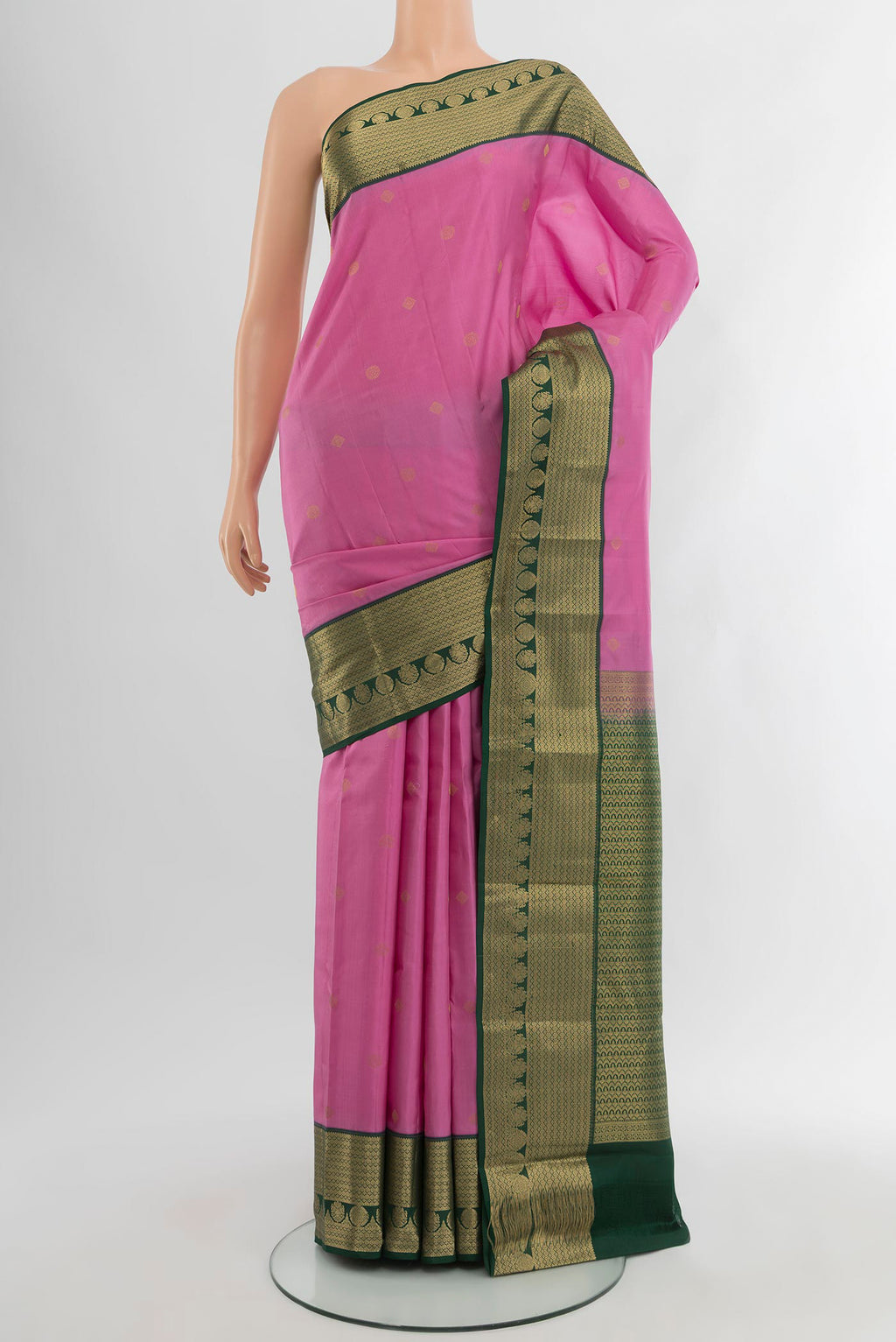 Rose pink Kanchipuram Silk Saree with Zari Butta on the body and Zari Border.  displayed on a mannequin