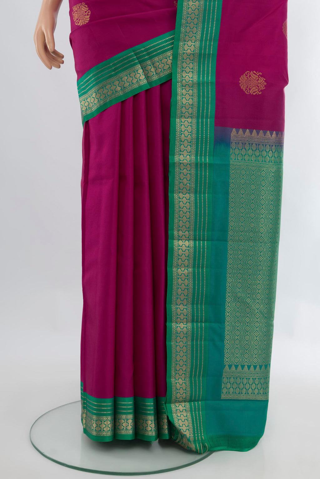 Pleats and pallu of Magenta Kanchipuram Silk Saree with Zari Butta on the body and Zari Border. 