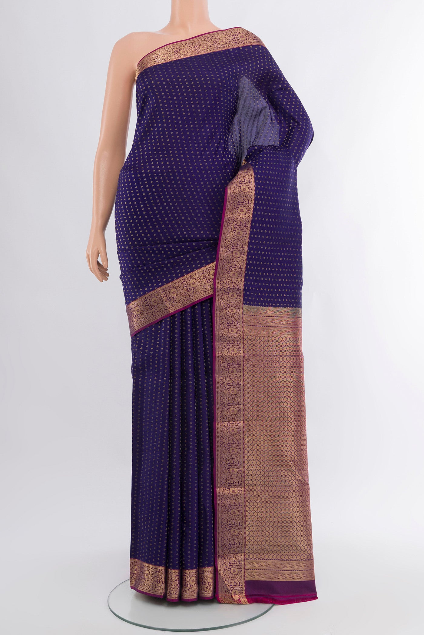 Navy Blue Kanchipuram Silk Saree with Zari Butta on the body and Zari Border.  displayed on a mannequin