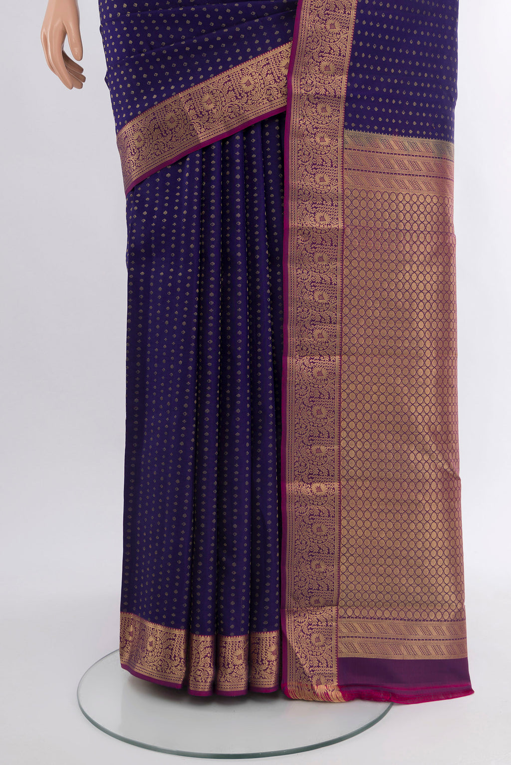 Pleats and pallu of Navy Blue Kanchipuram Silk Saree with Zari Butta on the body and Zari Border. 