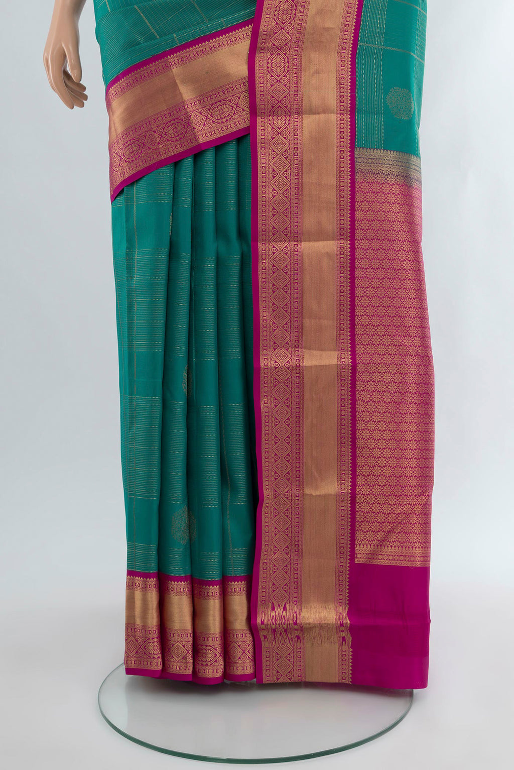 Pleats and pallu of Peacock Blue Kanjivaram Silk Saree with Checked design on the body and Zari Border. 