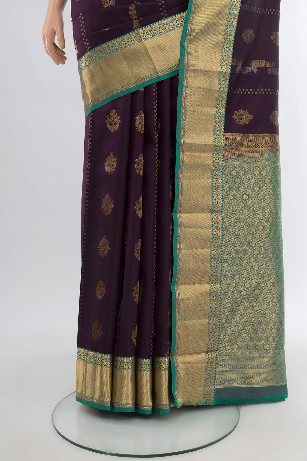Pleats and pallu of Purple Kanjivaram Silk Saree with Zari Butta on the body and Zari Border. 