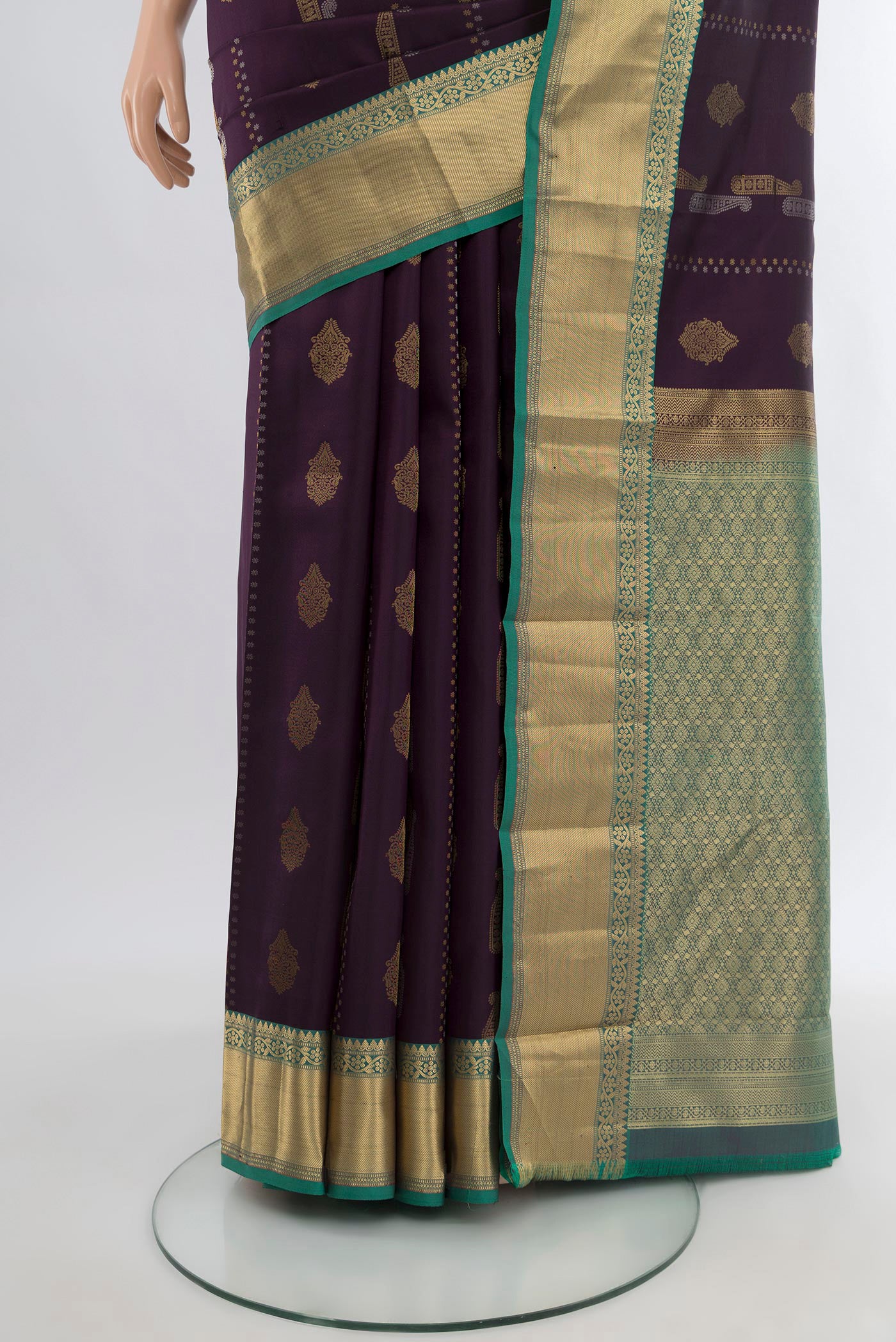 Pleats and pallu of Purple Kanjivaram Silk Saree with Zari Butta on the body and Zari Border. 