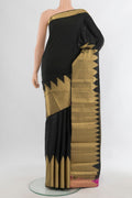 Pure Silk Black Kanchipuram Saree with Plain Body and Zari Border.  displayed on a mannequin