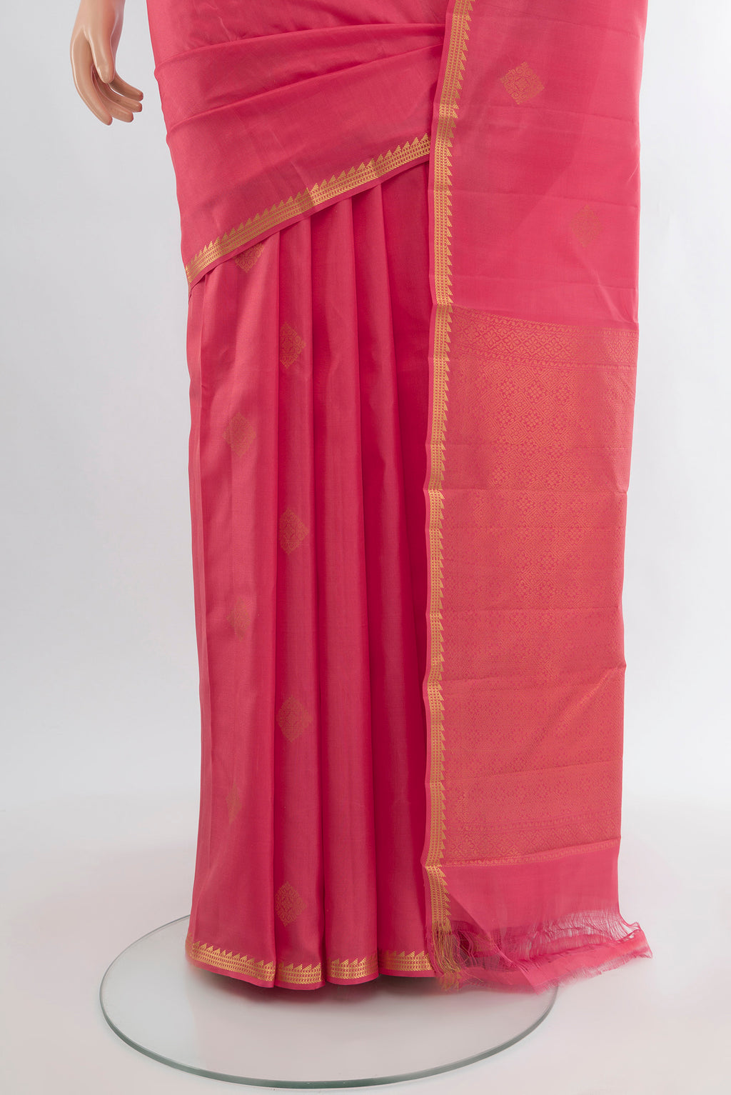 Pleats and pallu of Pink Kanjivaram Silk Saree with Zari Butta on the body and Zari Border. 
