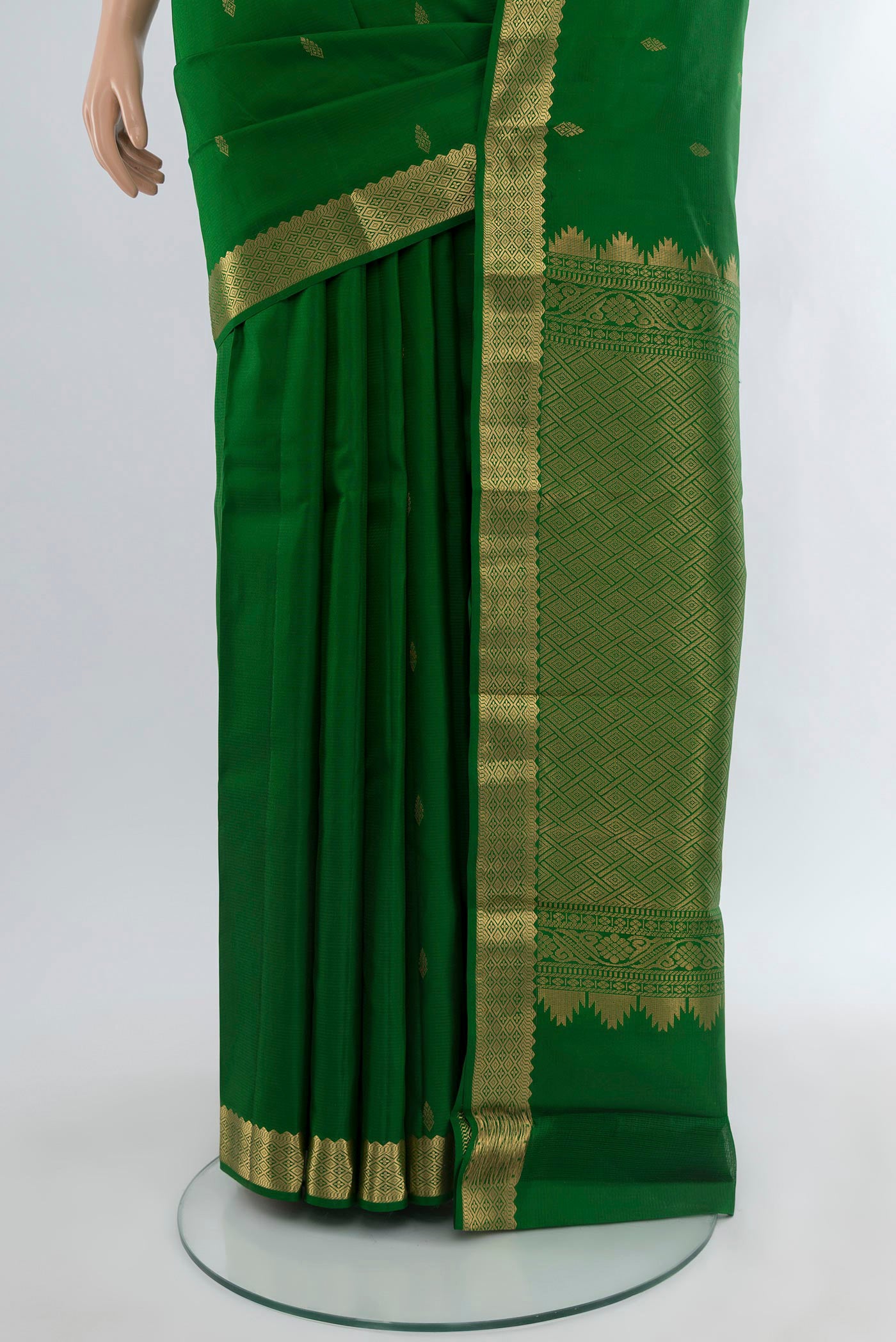 Pleats and pallu of Green Kanjivaram Silk Saree with Zari Butta on the body and Zari Border. 