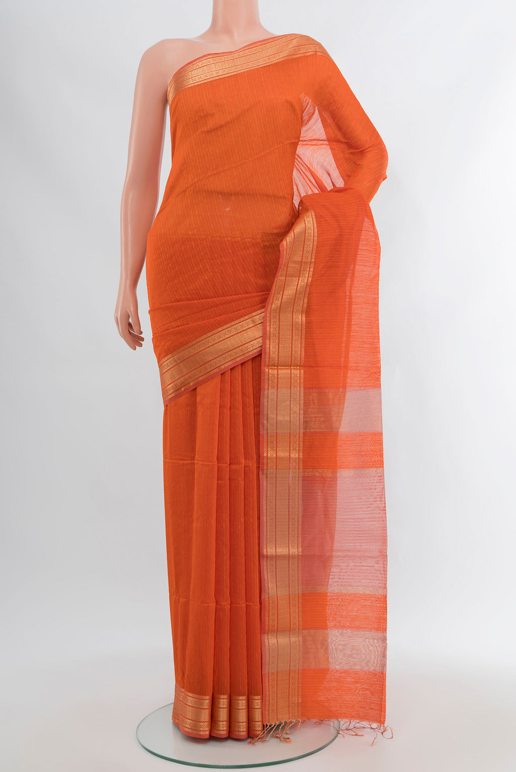 Orange Maheshwari Silk Cotton Saree with Stripes on the body and Zari Border.  displayed on a mannequin
