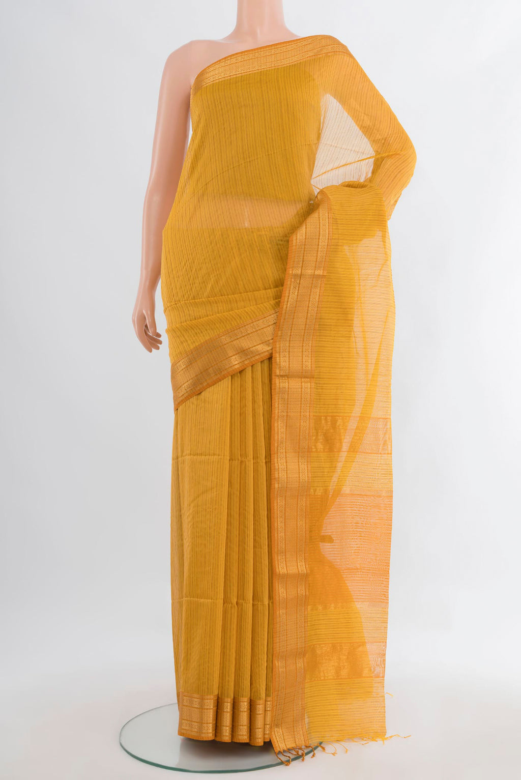 Mustard Maheshwari Cotton Saree with Stripes on the body and Zari Border.  displayed on a mannequin