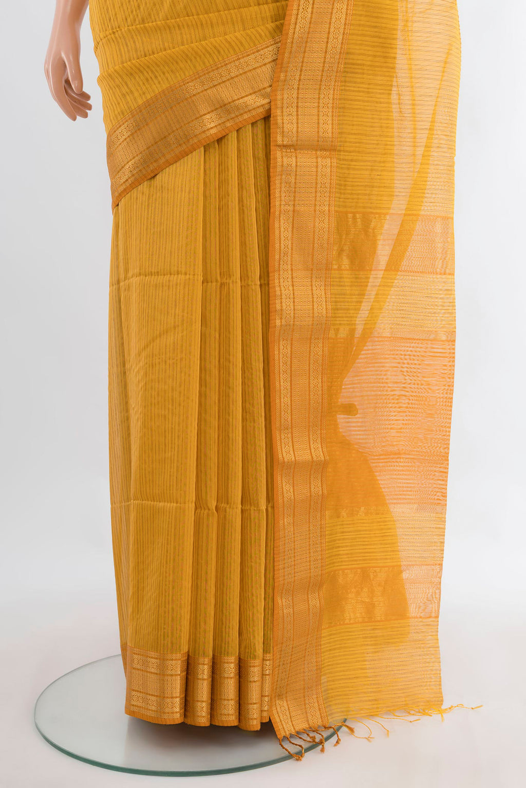 Pleats and pallu of Mustard Maheshwari Cotton Saree with Stripes on the body and Zari Border. 