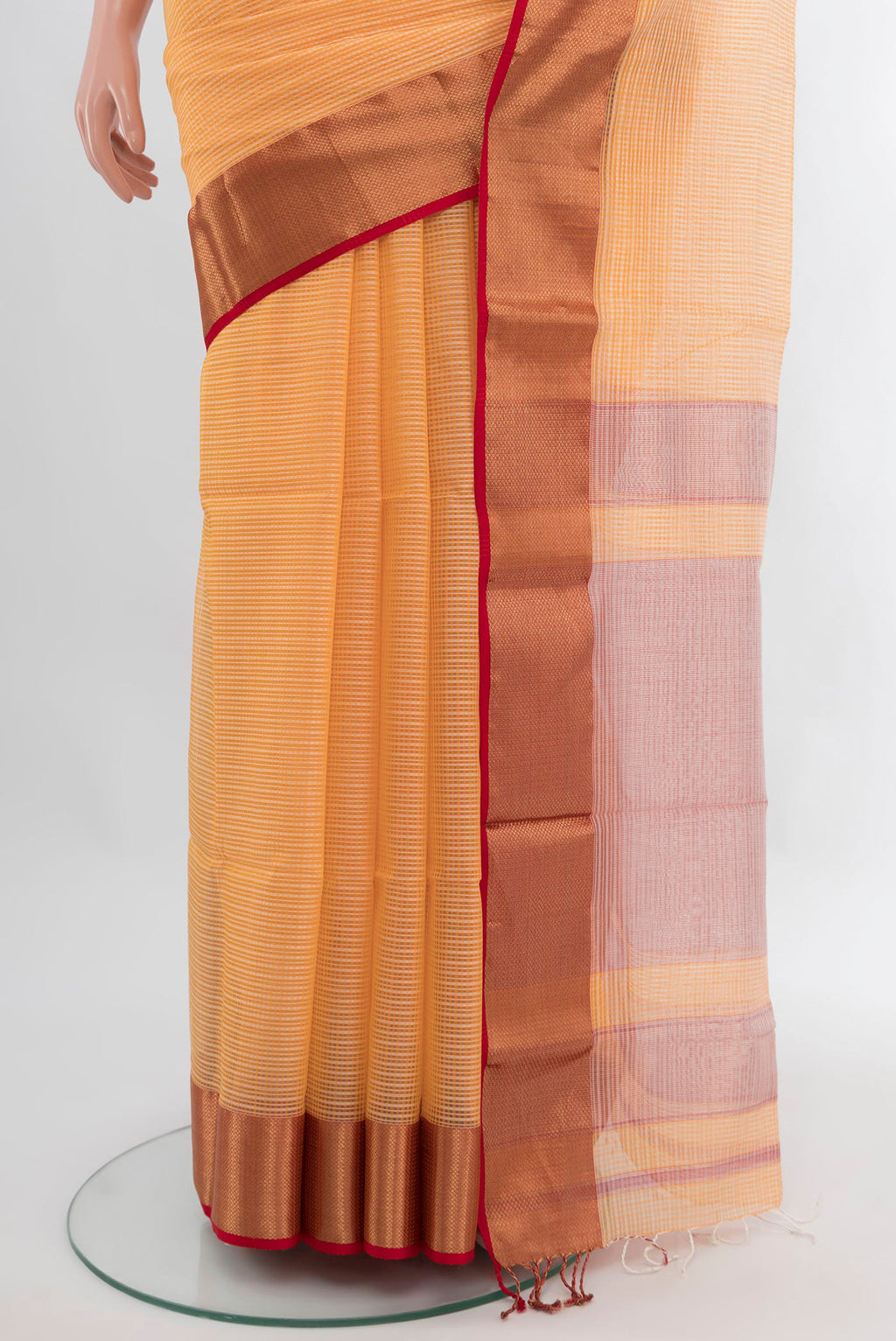 Pleats and pallu of Peach Maheshwari Silk Cotton Saree with Stripes on the body and Zari Border. 