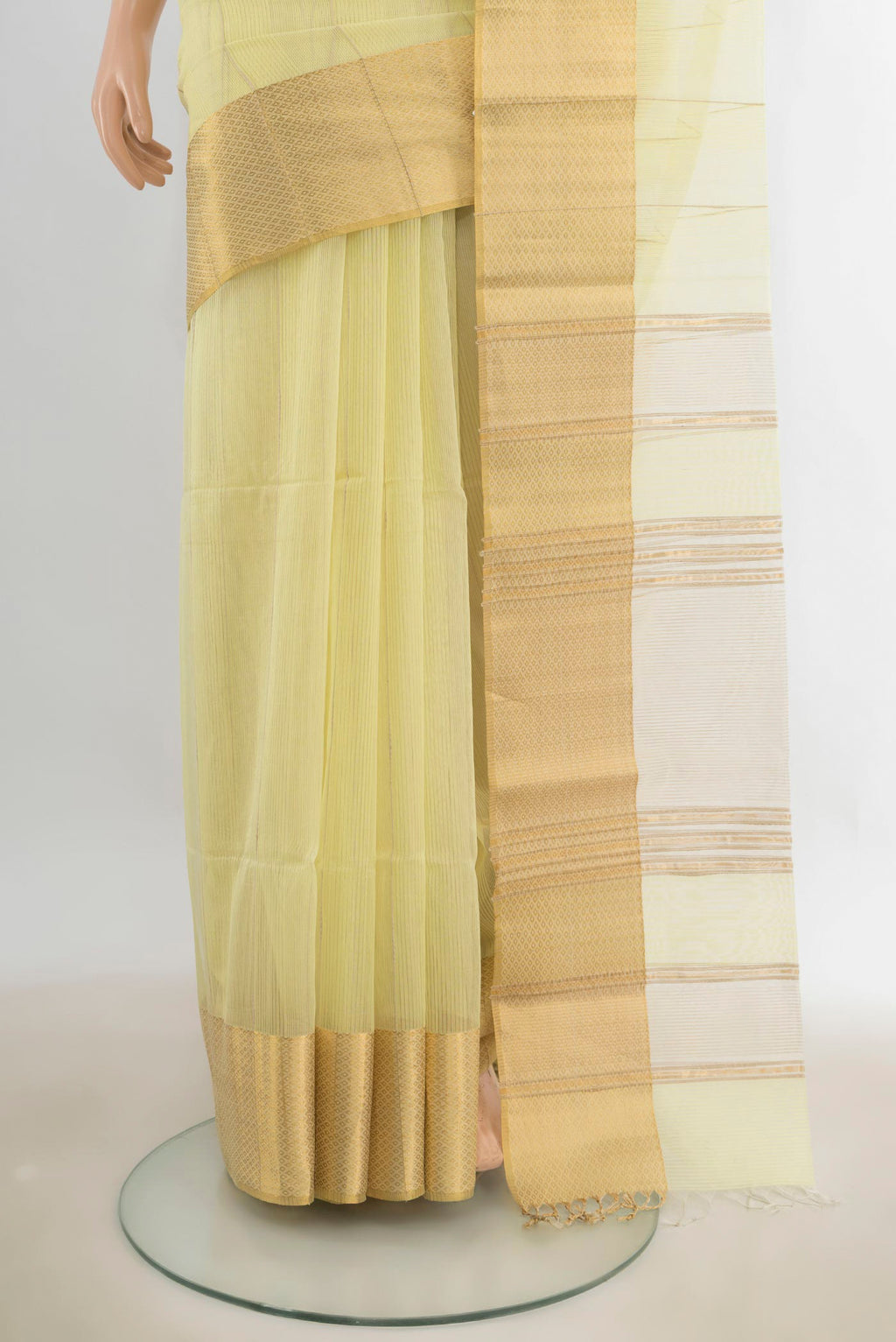 Pleats and pallu of Lemon Yellow Maheshwari Cotton Saree with Stripes on the body and Zari Border. 