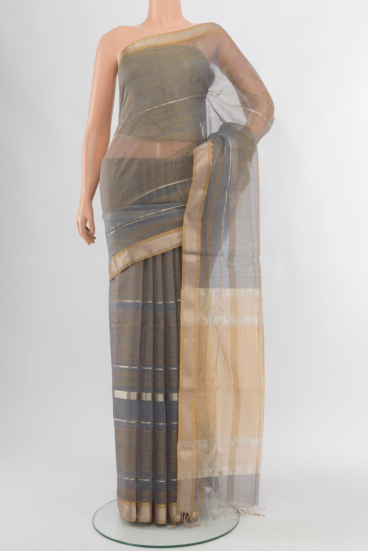 Multi Color Maheshwari Silk Cotton Saree with Checked design on the body and Zari Border.  displayed on a mannequin