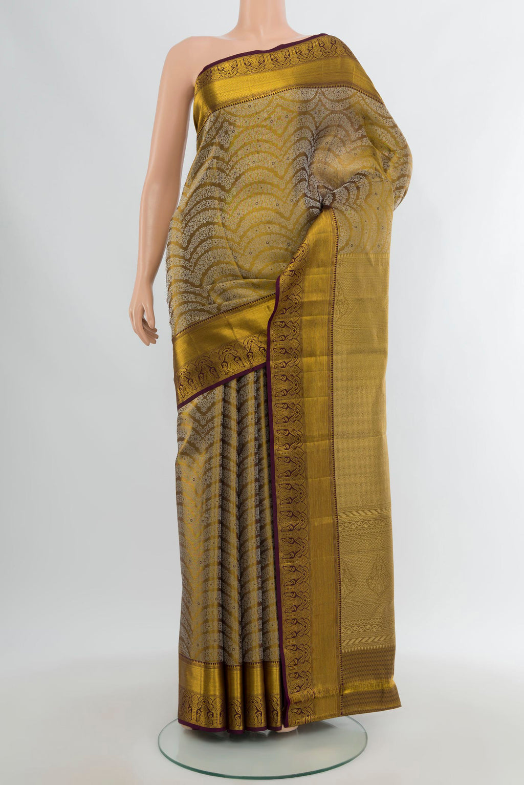 Mehandi Green Kanchipuram Silk Saree with Zari Brocade on the body and Zari Border.  displayed on a mannequin