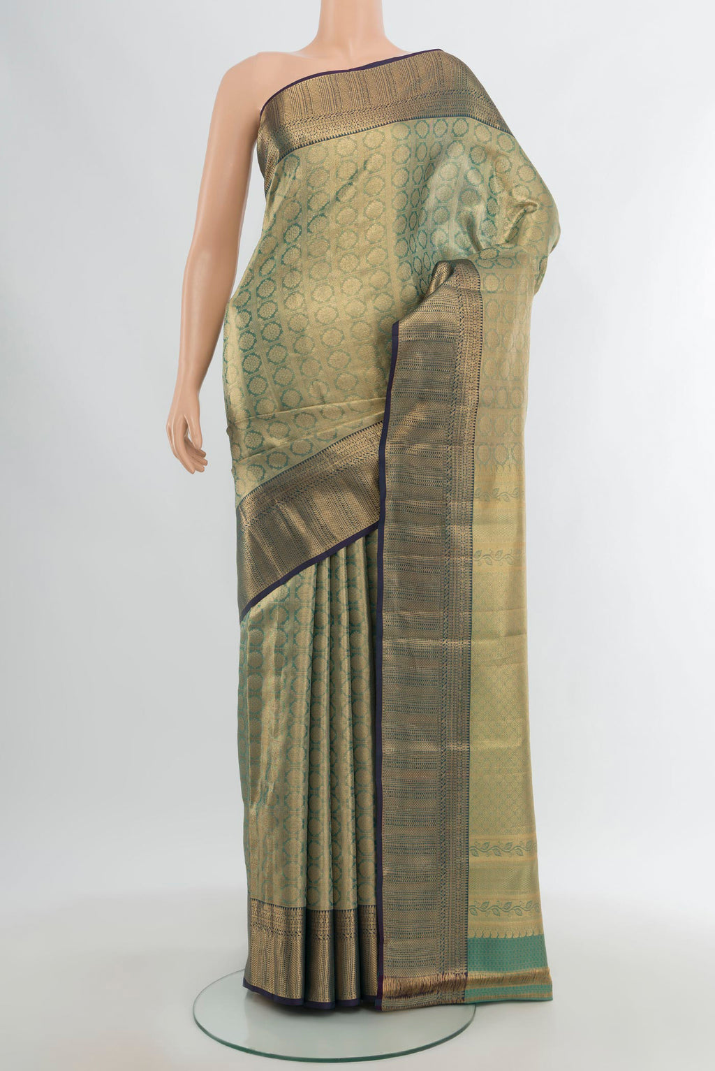 Gold Kanchipuram Tissue Silk Saree with Zari Brocade on the body and Zari Border.  displayed on a mannequin