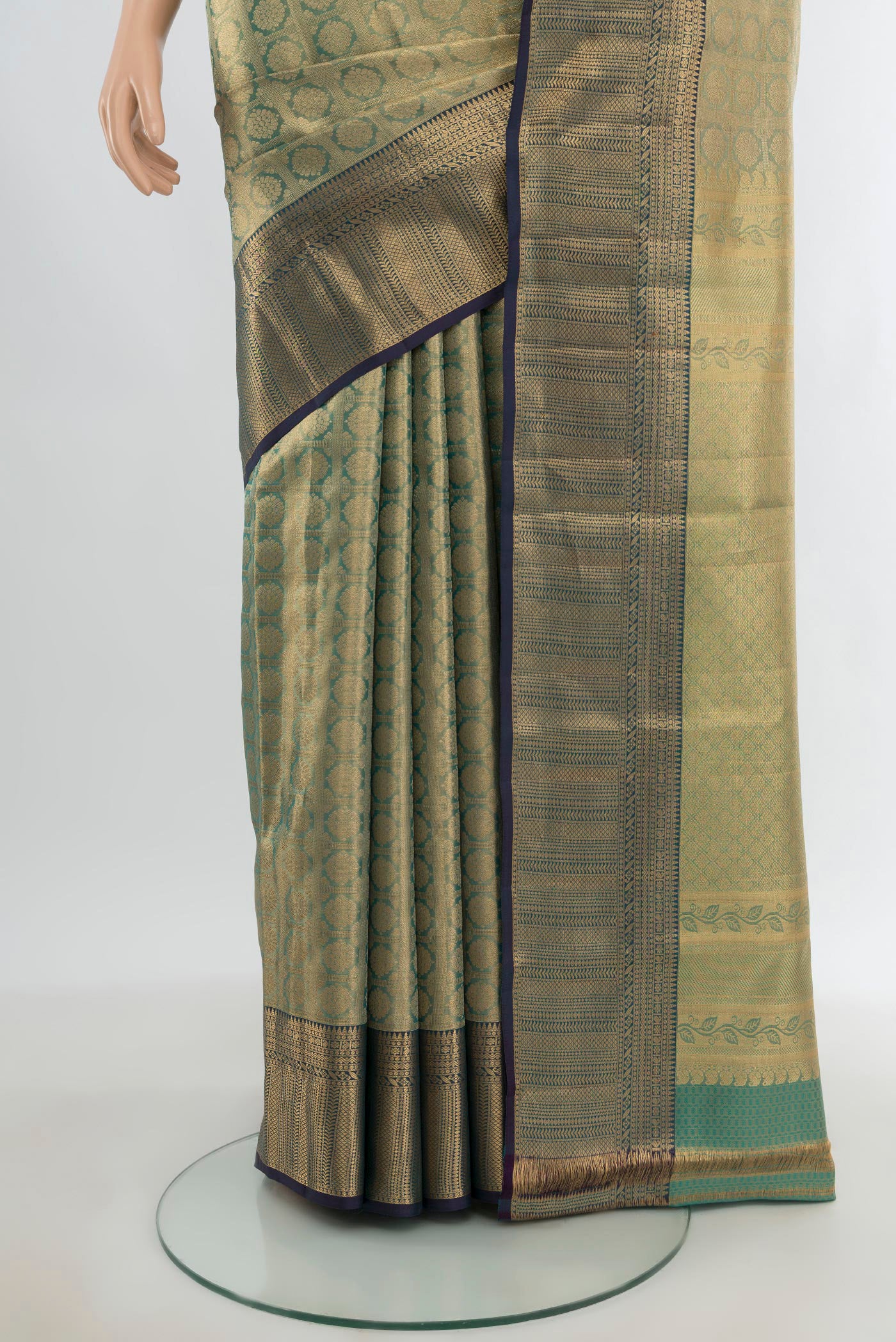 Pleats and pallu of Gold Kanchipuram Tissue Silk Saree with Zari Brocade on the body and Zari Border. 